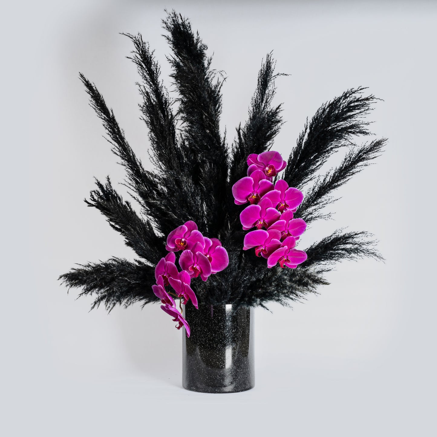 Black and fuschia flower arrangement