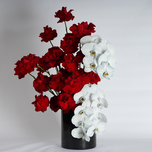 red roses and blue orchids flower arrangement