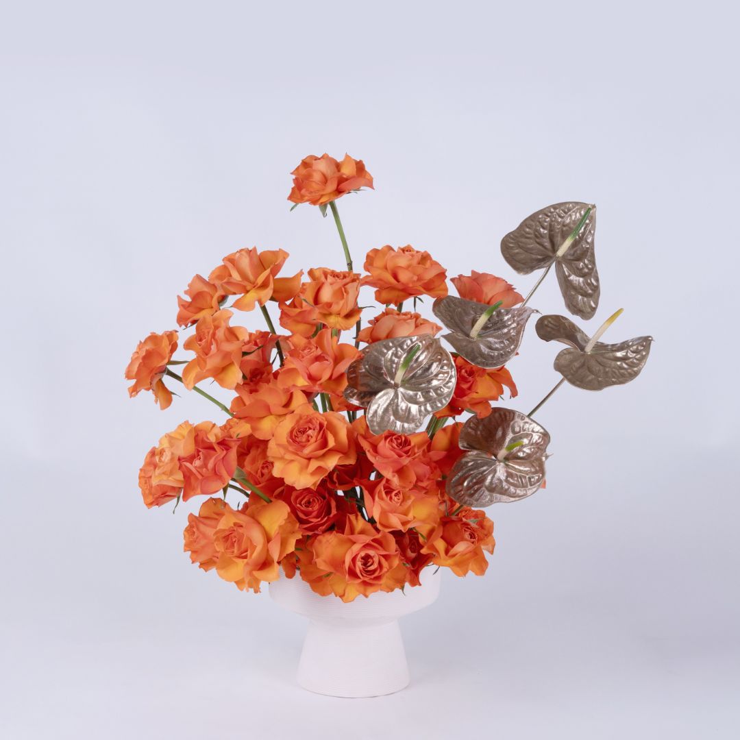 Metalic Tangerine | Orange Roses & Golden Anthirium Flower arrangement