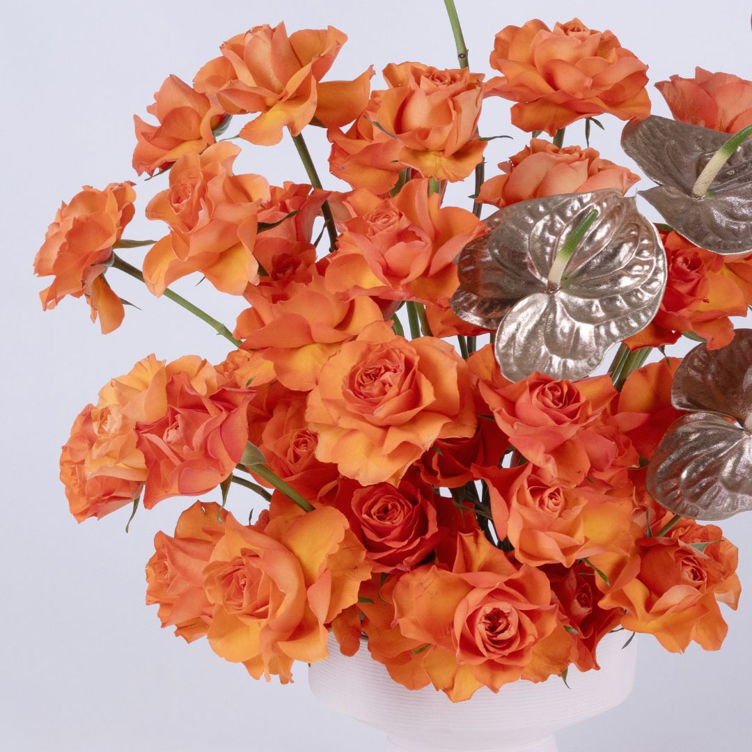 Metalic Tangerine | Orange Roses & Golden Anthirium Flower arrangement